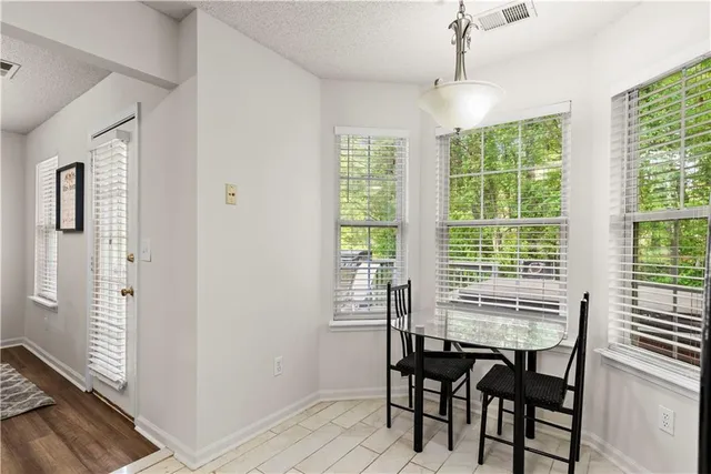 a view of a dining room with furniture window and outside view