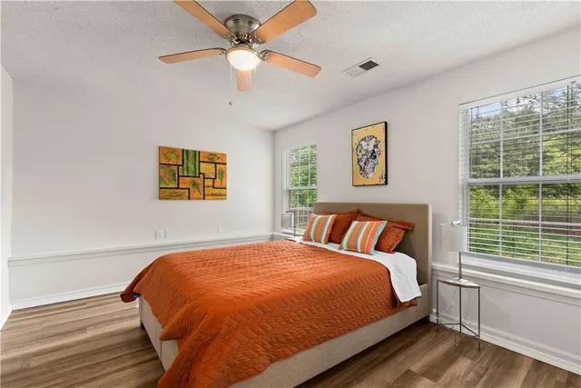 a bedroom with a large bed and a window