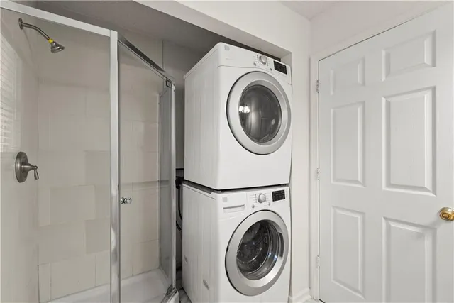 a view of a hallway with washer and dryer