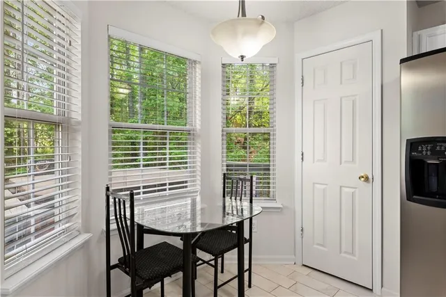 a view of a dining room with furniture window and outside view