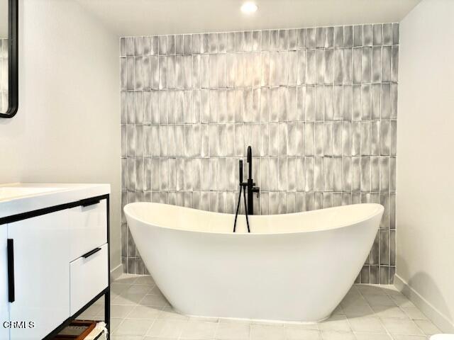 4510 Gateshead Bay Oxnard, CA 93035 - Photo 21 of 34 a white bath tub sitting in a bathroom