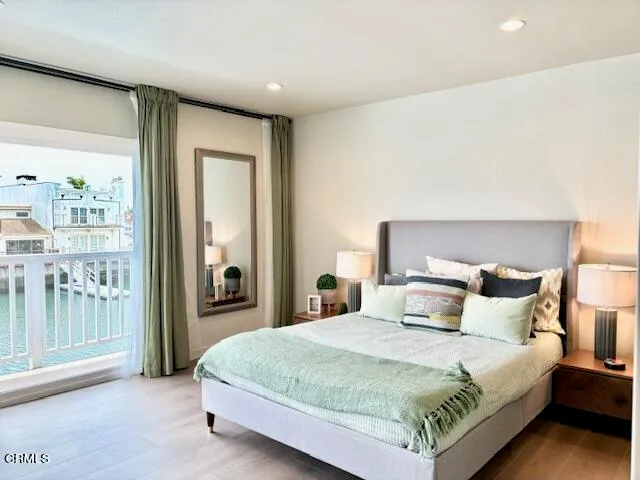 a bedroom with a bed and a night stand