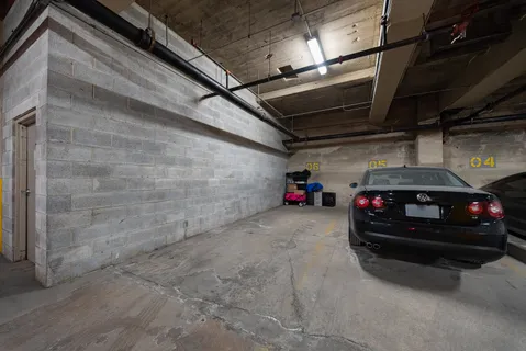 a view of garage with cars