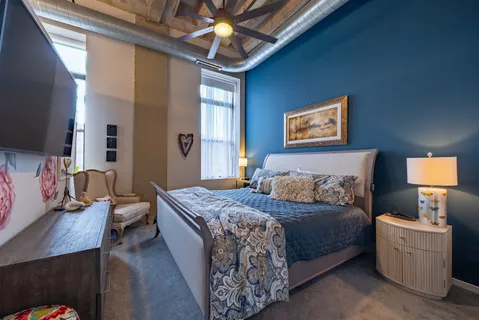 a bedroom with a bed and a couch