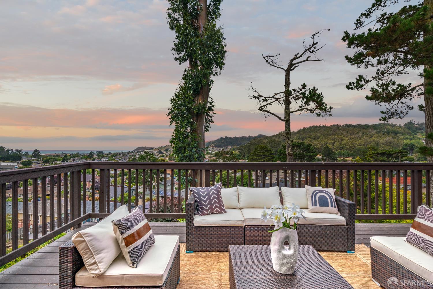 a view of a patio with couches chairs and a table