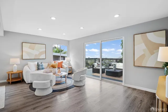 a bathroom with a granite countertop sink a toilet a mirror and shower