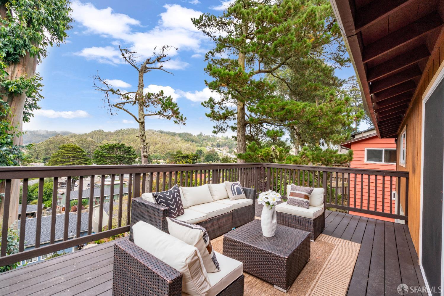 1669 Higgins Way Pacifica, CA 94044 - Photo 19 of 91 a view of a balcony with wooden floor and outdoor seating