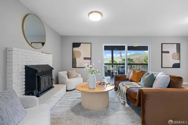 a bedroom with a bed and painting on the wall