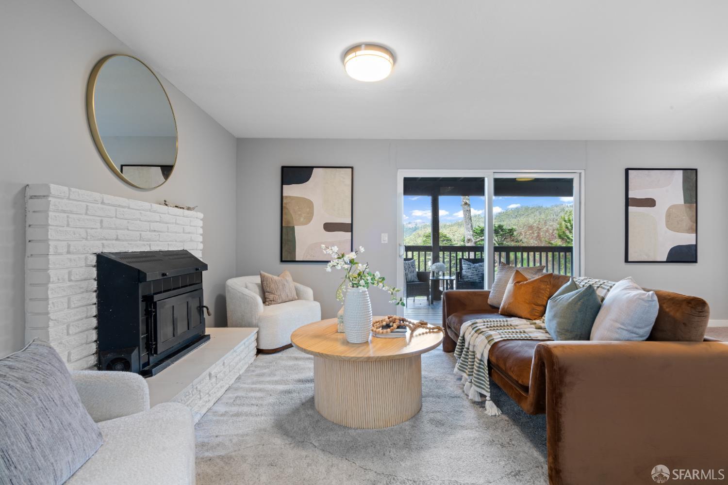 1669 Higgins Way Pacifica, CA 94044 - Photo 28 of 91 a living room with furniture and a fireplace