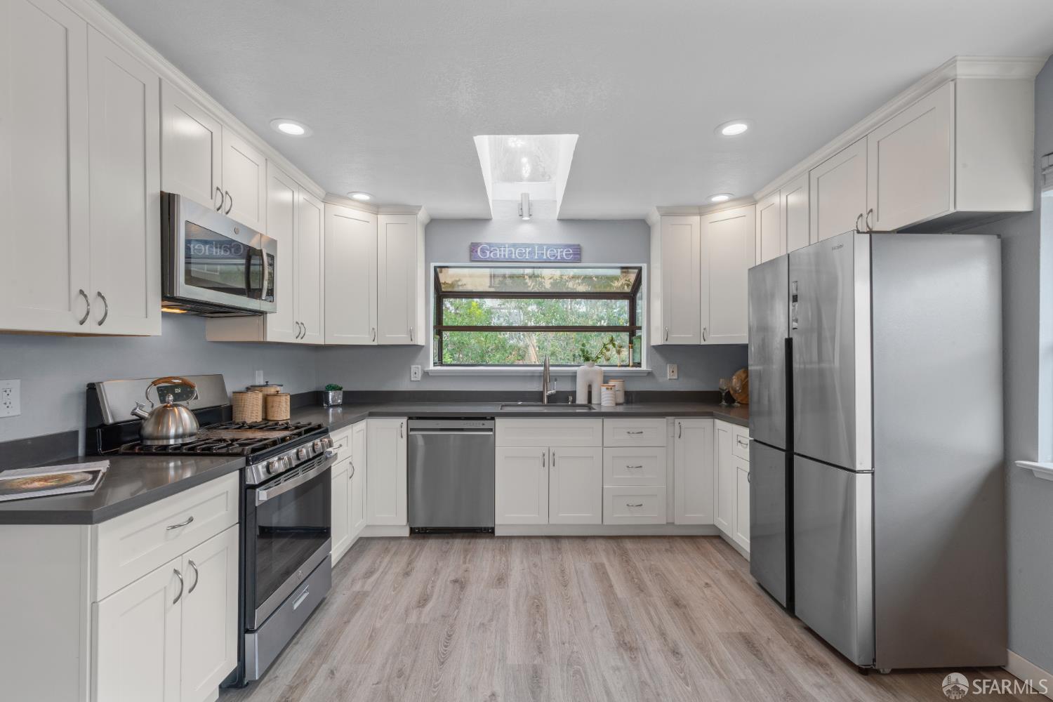 1669 Higgins Way Pacifica, CA 94044 - Photo 3 of 91 a kitchen with stainless steel appliances granite countertop a refrigerator a stove a sink and a microwave