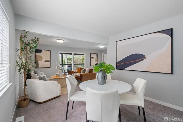 a view of a two chairs in the balcony