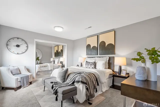 a view of living room with furniture and wooden floor