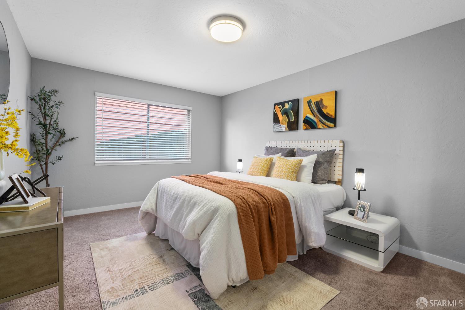 1669 Higgins Way Pacifica, CA 94044 - Photo 38 of 91 a bedroom with a bed and a potted plant