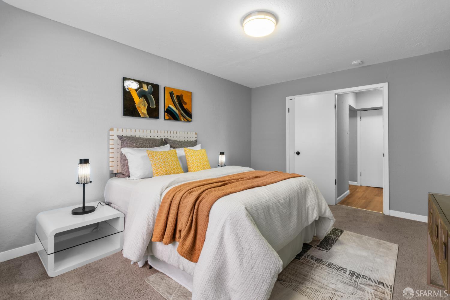 1669 Higgins Way Pacifica, CA 94044 - Photo 39 of 91 a bedroom with a bed and lamp