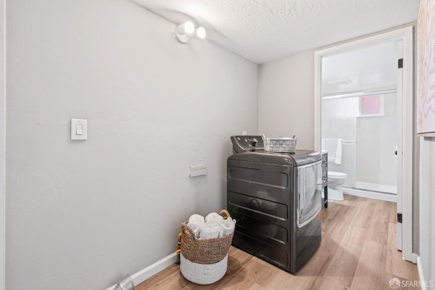 1669 Higgins Way Pacifica, CA 94044 - Photo 42 of 91 a kitchen with a refrigerator and a wooden floor