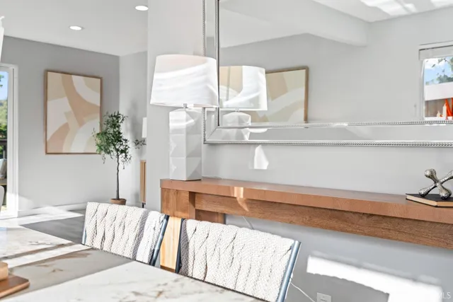 a view of a dining room with furniture window and outside view