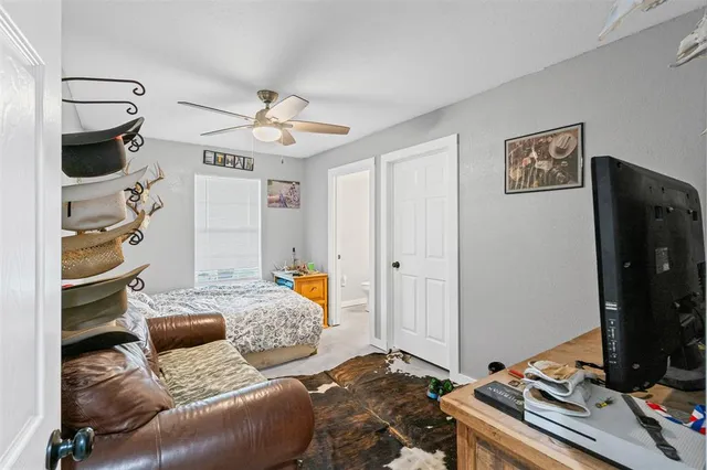 a bedroom with furniture and a window