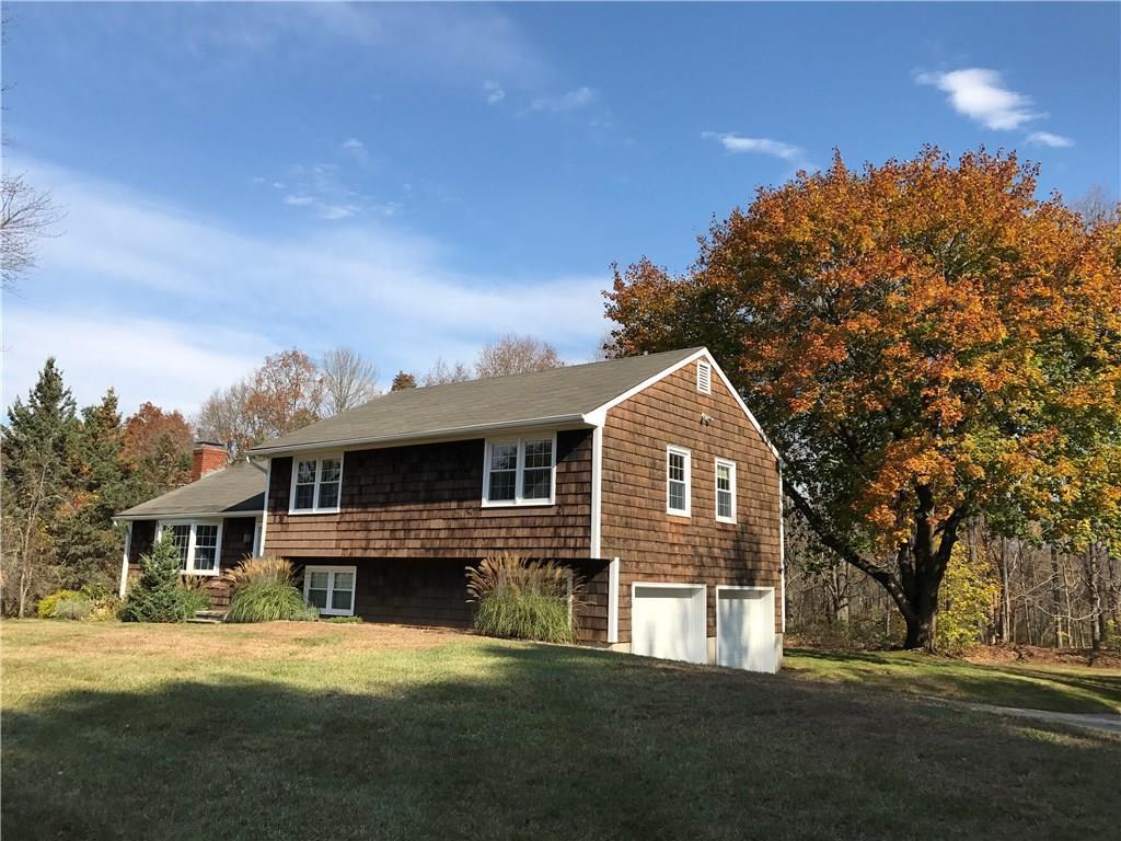 8 Dodge Farm Road Washington, CT 06794 - Photo 1 of 1 a front view of a house with a garden