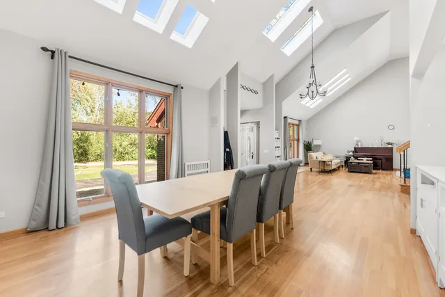 a view of a living room kitchen and a wooden floor