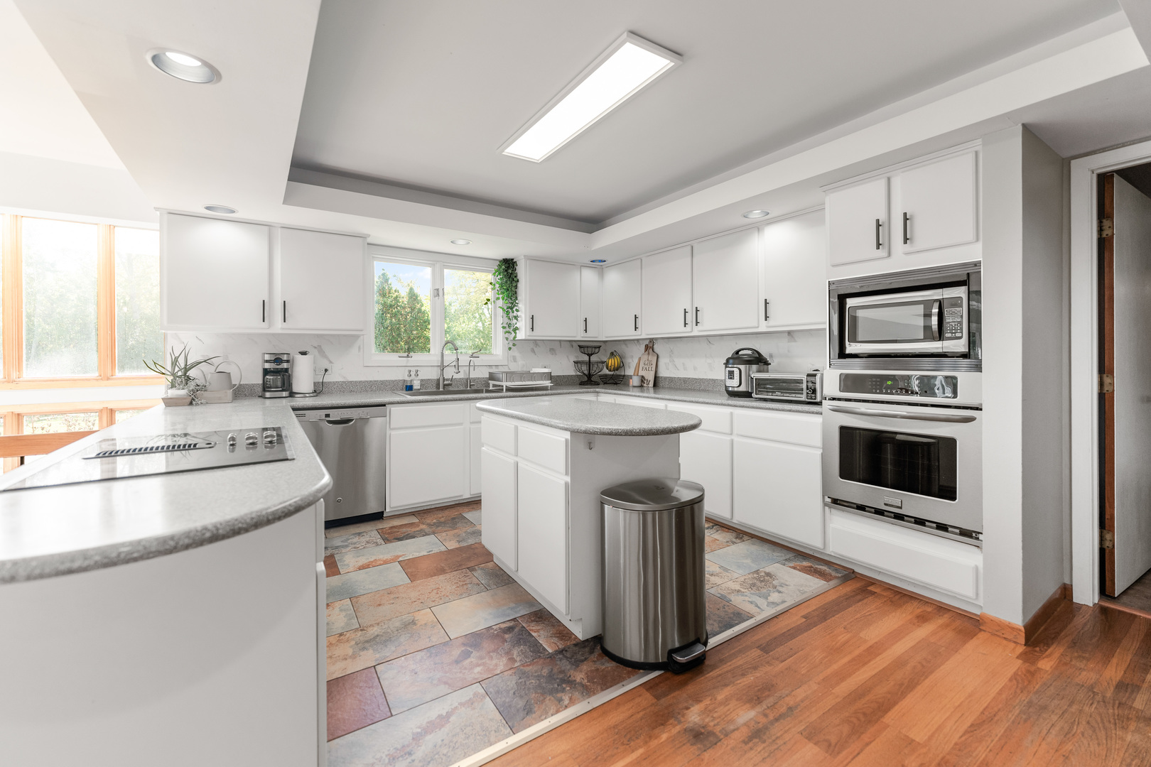 336 Roberts Road Inverness, IL 60010 - Photo 16 of 80 a kitchen with granite countertop a sink stainless steel appliances and cabinets