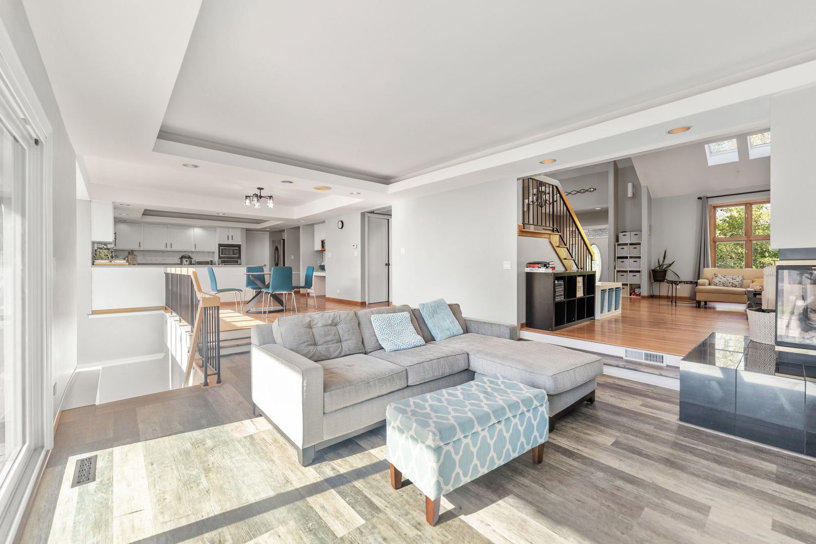 336 Roberts Road Inverness, IL 60010 - Photo 23 of 80 a living room with furniture and a dining table with kitchen view