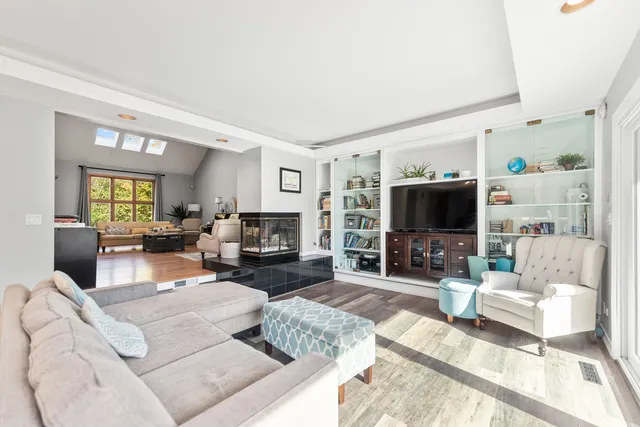 a kitchen with stainless steel appliances granite countertop a sink and cabinets