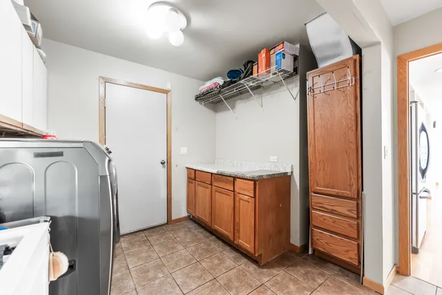 a bathroom with a double vanity sink mirror and shower