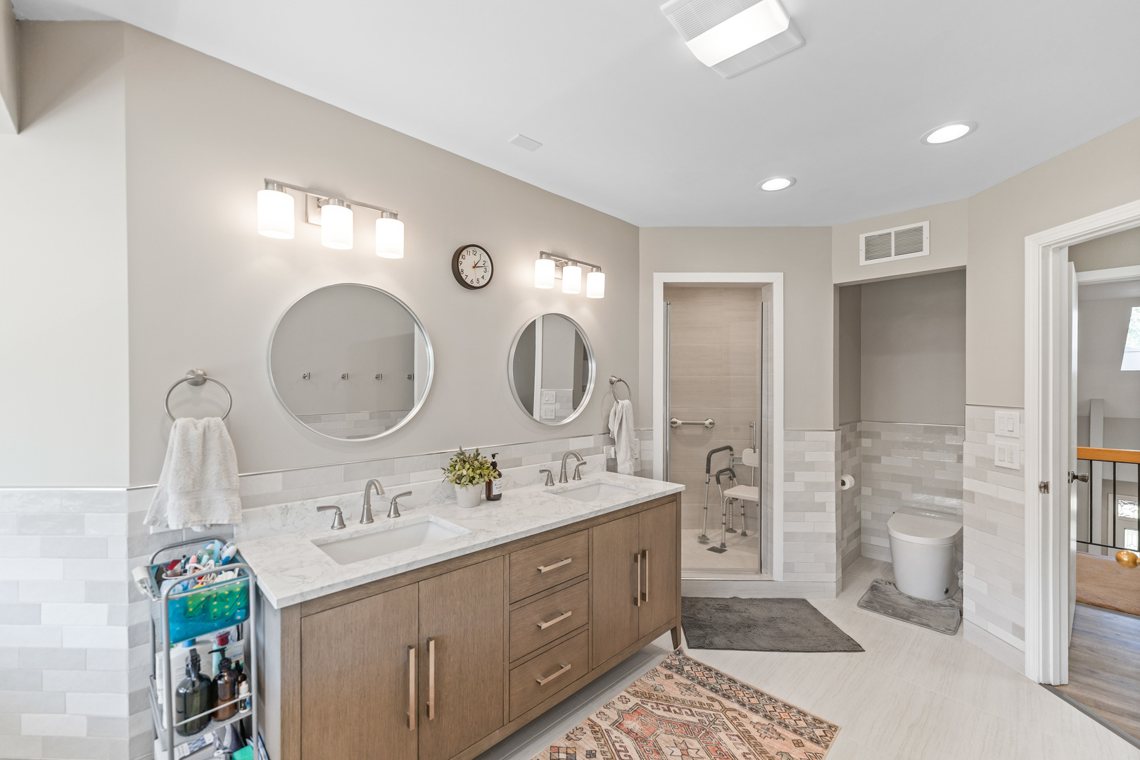 336 Roberts Road Inverness, IL 60010 - Photo 40 of 80 a bathroom with a double vanity sink mirror and shower