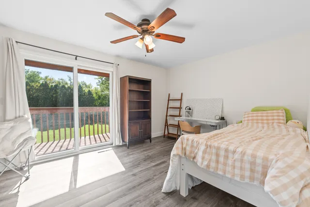 a view of a chairs and tables in the back yard of the house
