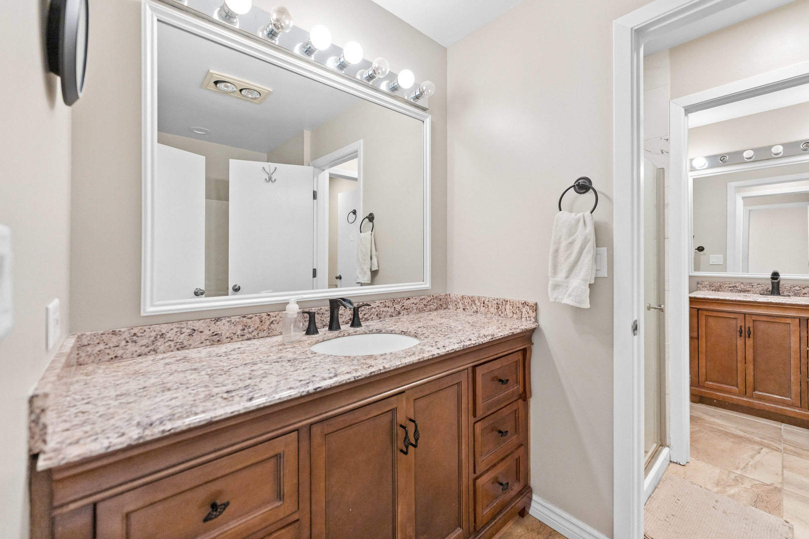 336 Roberts Road Inverness, IL 60010 - Photo 48 of 80 a bathroom with a granite countertop double vanity sink and a mirror