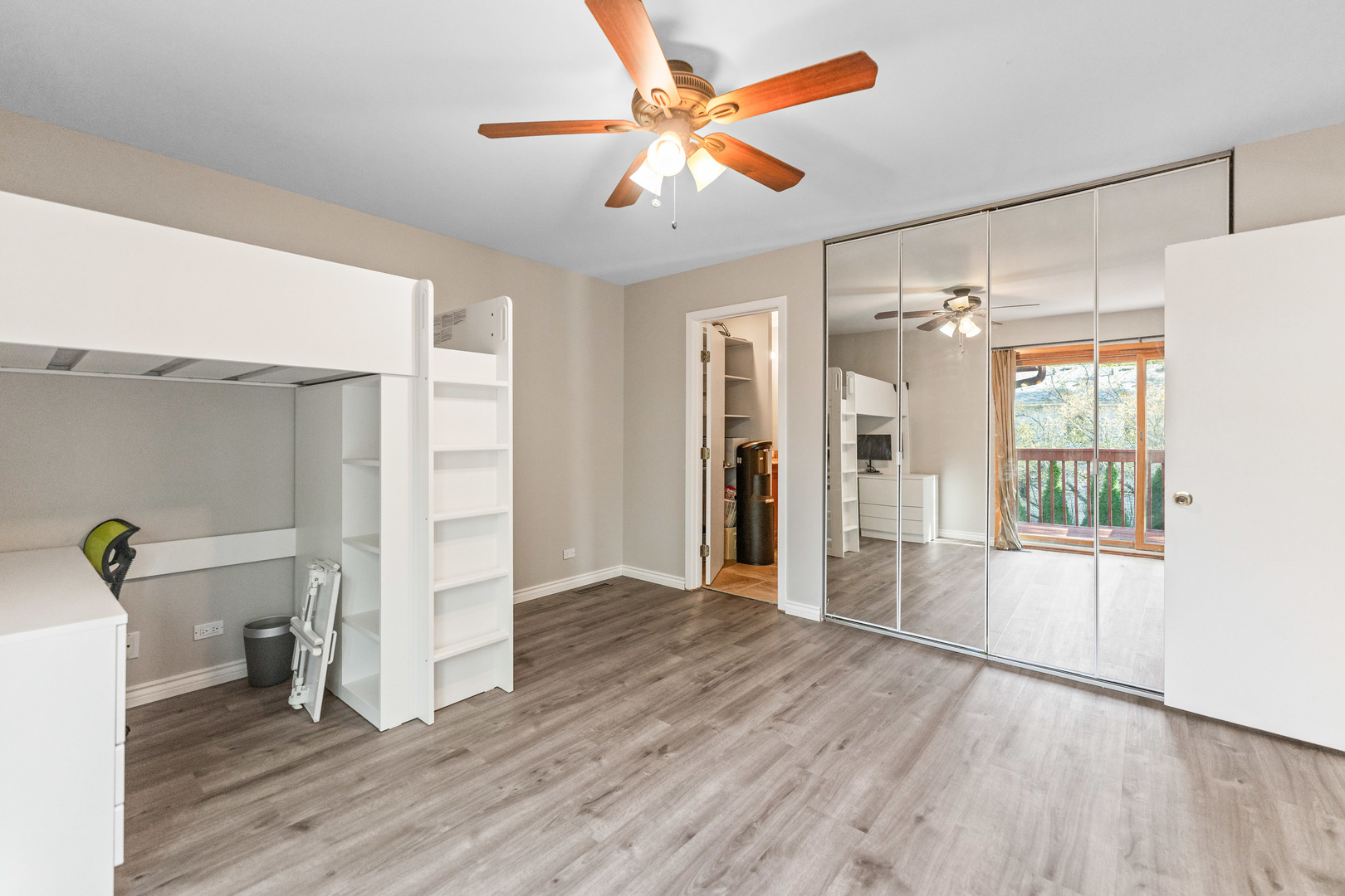 336 Roberts Road Inverness, IL 60010 - Photo 53 of 80 a view of empty room with wooden floor and fan