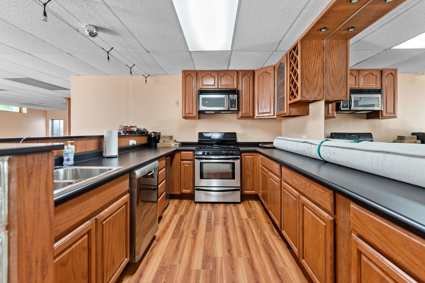336 Roberts Road Inverness, IL 60010 - Photo 62 of 80 a kitchen with granite countertop a sink stove and cabinets