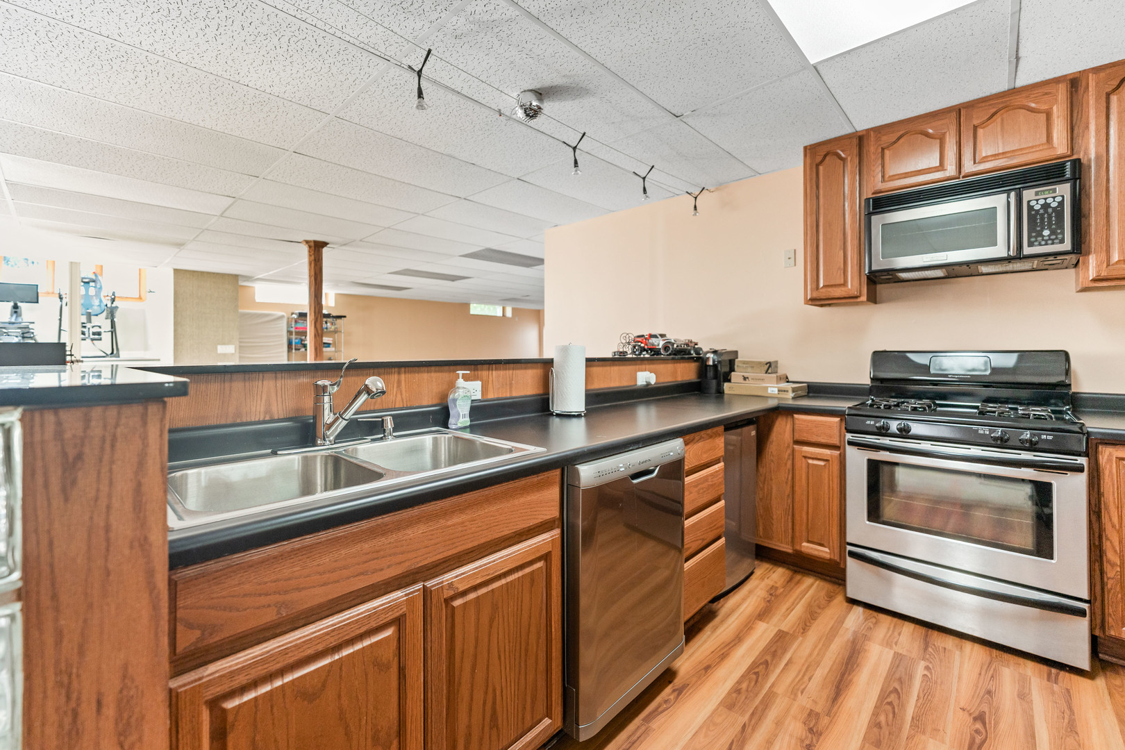 336 Roberts Road Inverness, IL 60010 - Photo 63 of 80 a kitchen with stainless steel appliances granite countertop a sink stove and microwave