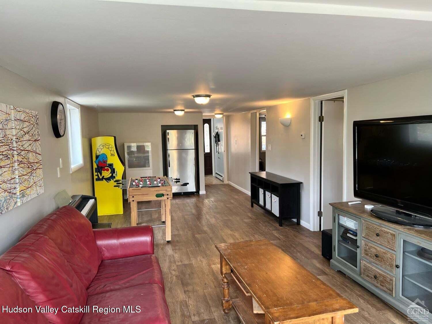 16 Hickory Hill Road Windham, NY 12496 - Photo 14 of 39 a living room with furniture and a flat screen tv