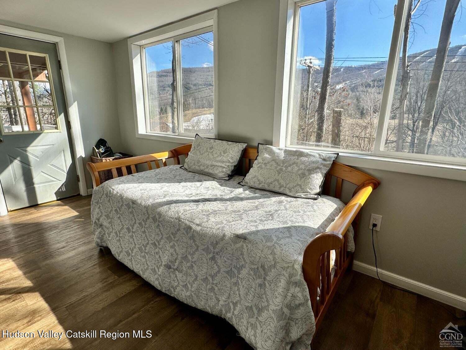 16 Hickory Hill Road Windham, NY 12496 - Photo 17 of 39 a bedroom with a bed window and wooden floor