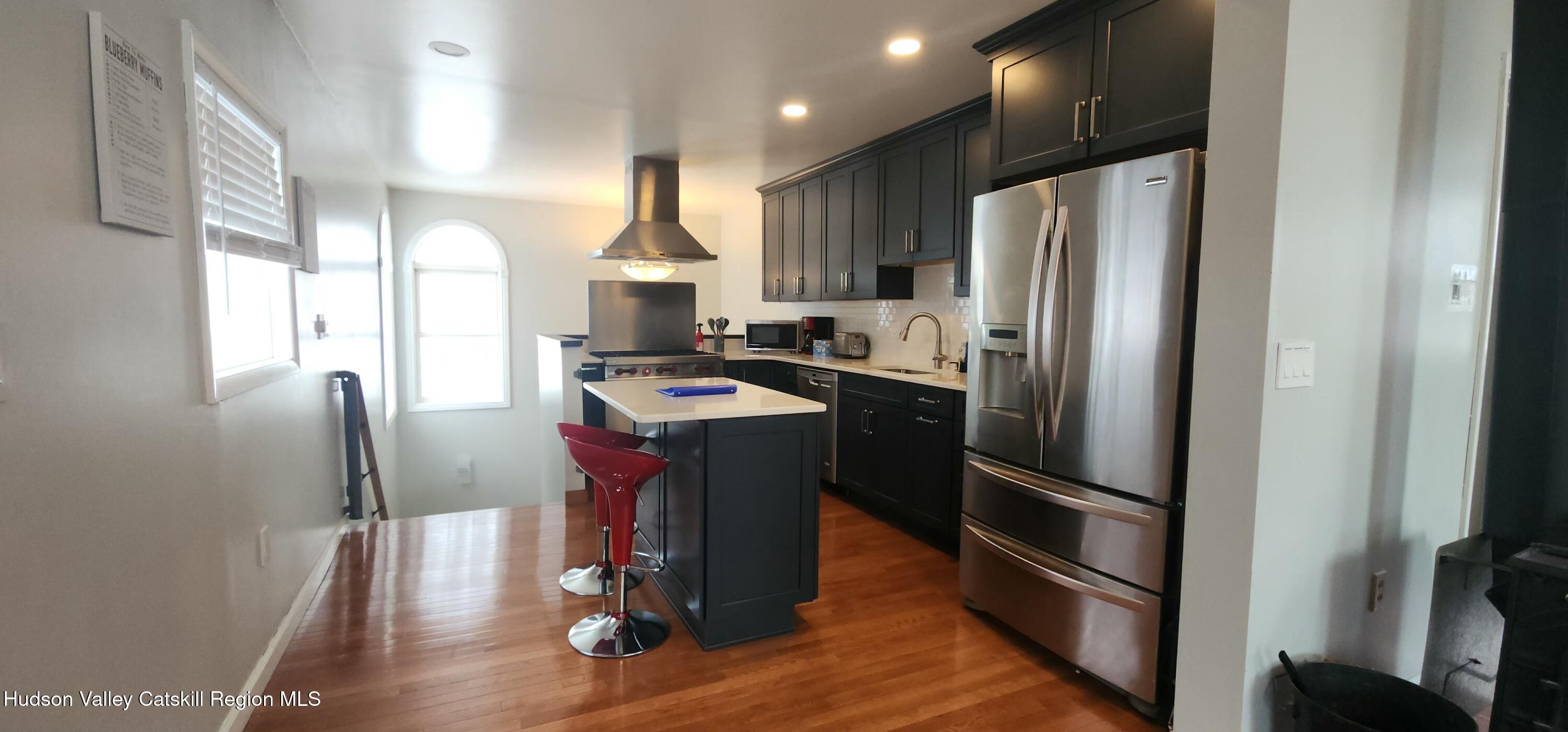 16 Hickory Hill Road Windham, NY 12496 - Photo 9 of 39 a kitchen with kitchen island stainless steel appliances a sink appliances and cabinets