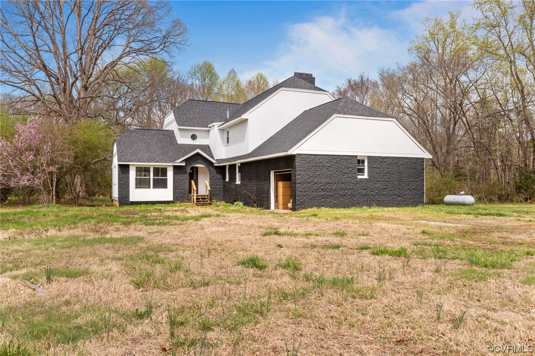 5660 Cartersville Road Powhatan, VA 23139 - Photo 1 of 15 a front view of a house with a yard and garage