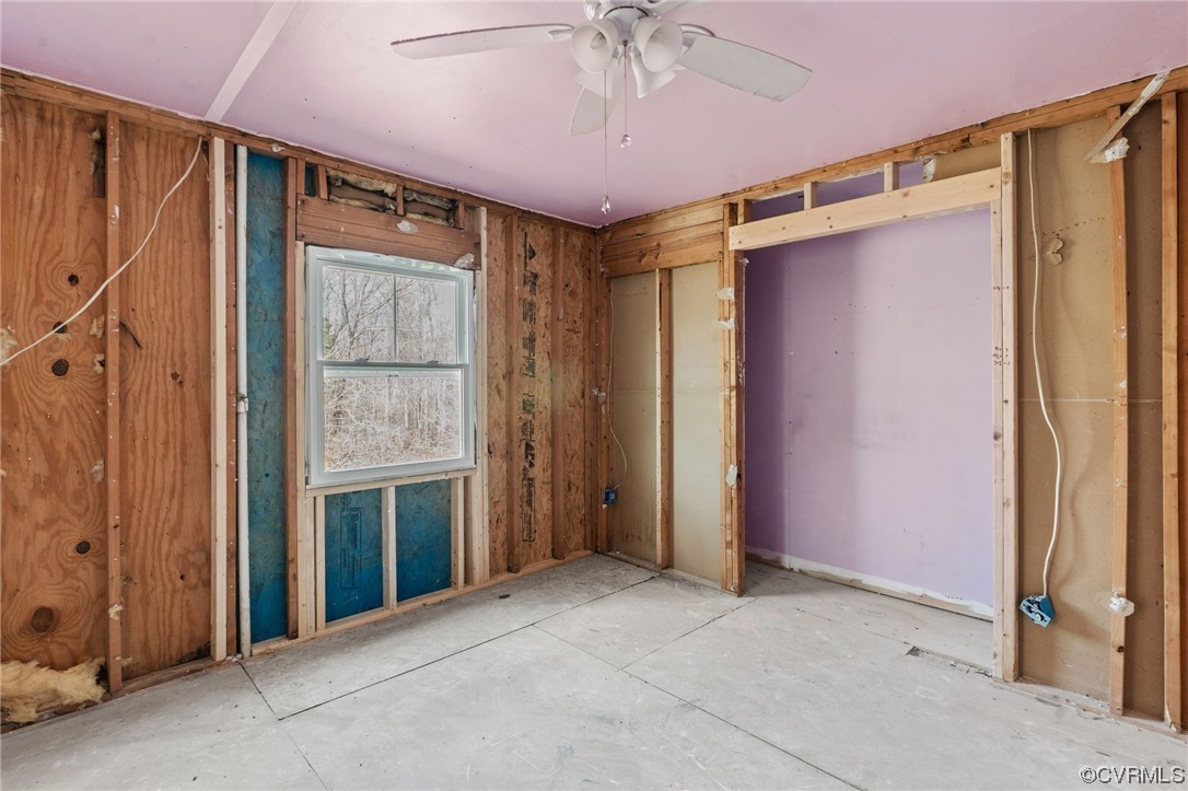 5660 Cartersville Road Powhatan, VA 23139 - Photo 14 of 15 an empty room with a ceiling fan and shower