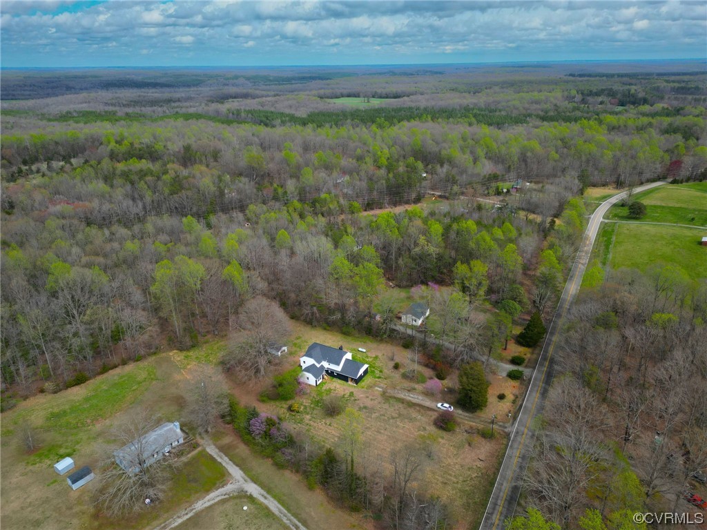 5660 Cartersville Road Powhatan, VA 23139 - Photo 5 of 15 a view of a yard with an outdoor space