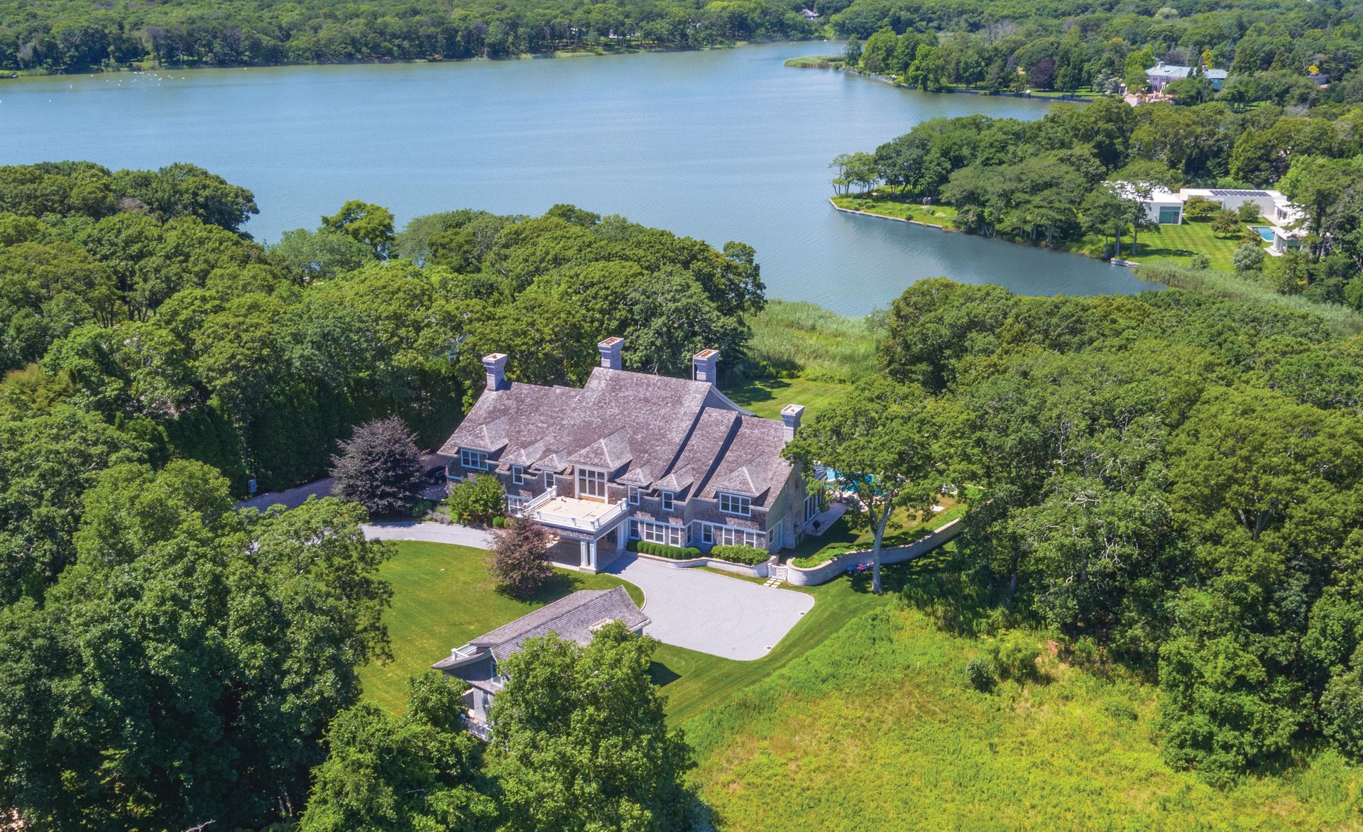 an aerial view of a house with a lake view
