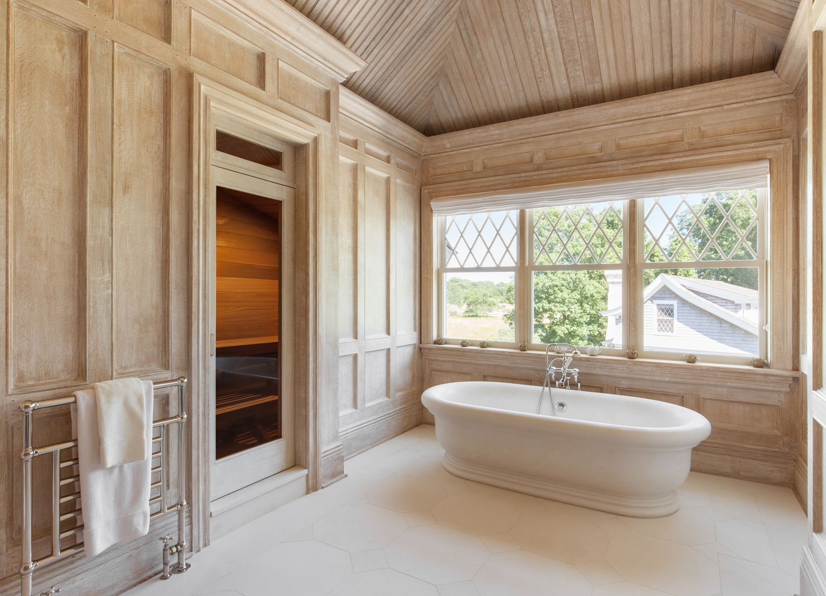 81 Briar Patch Road East Hampton, NY 11937 - Photo 14 of 25 a bathroom with a bathtub and next to a window