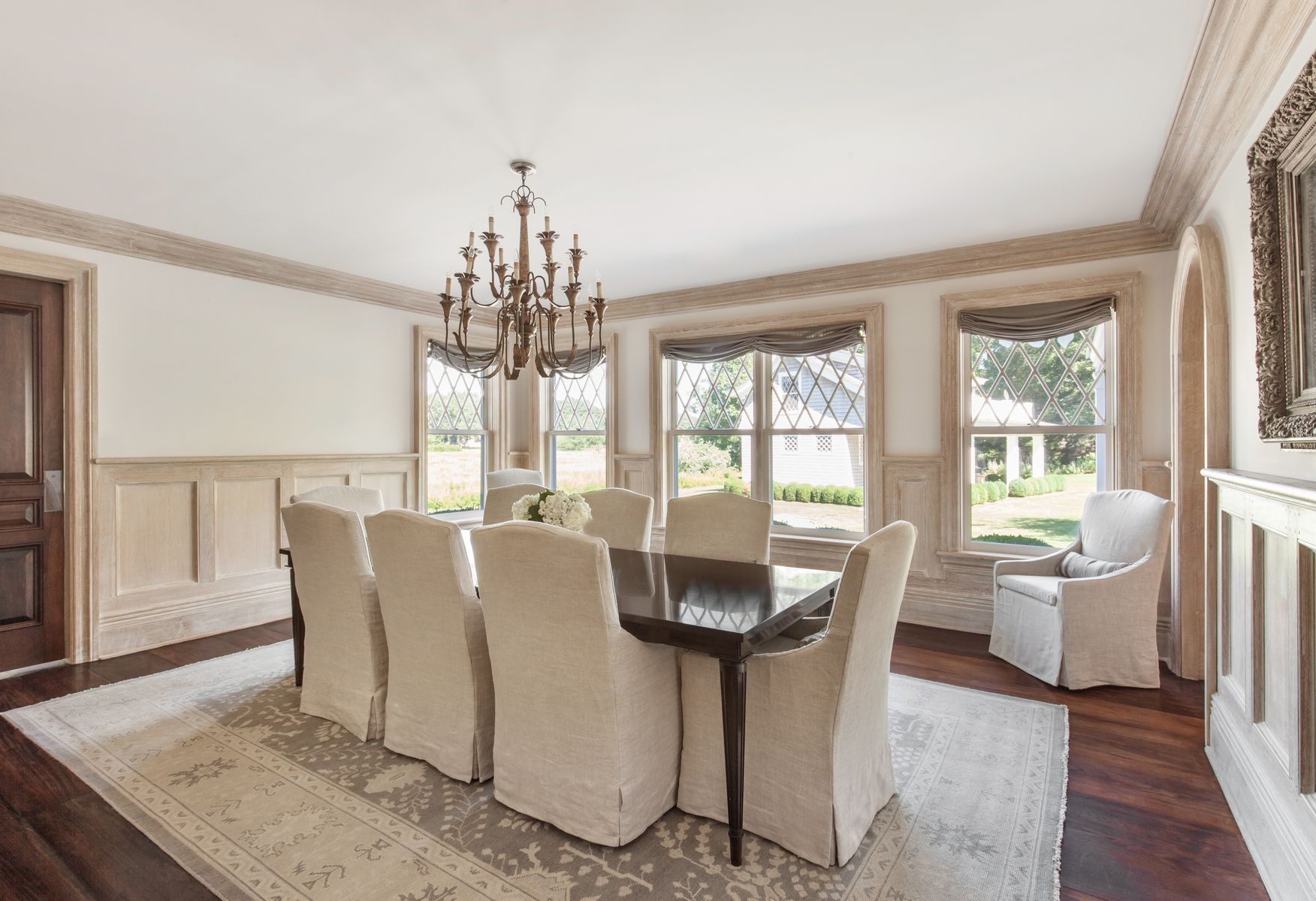 81 Briar Patch Road East Hampton, NY 11937 - Photo 19 of 25 a dining room with wooden floor and large windows