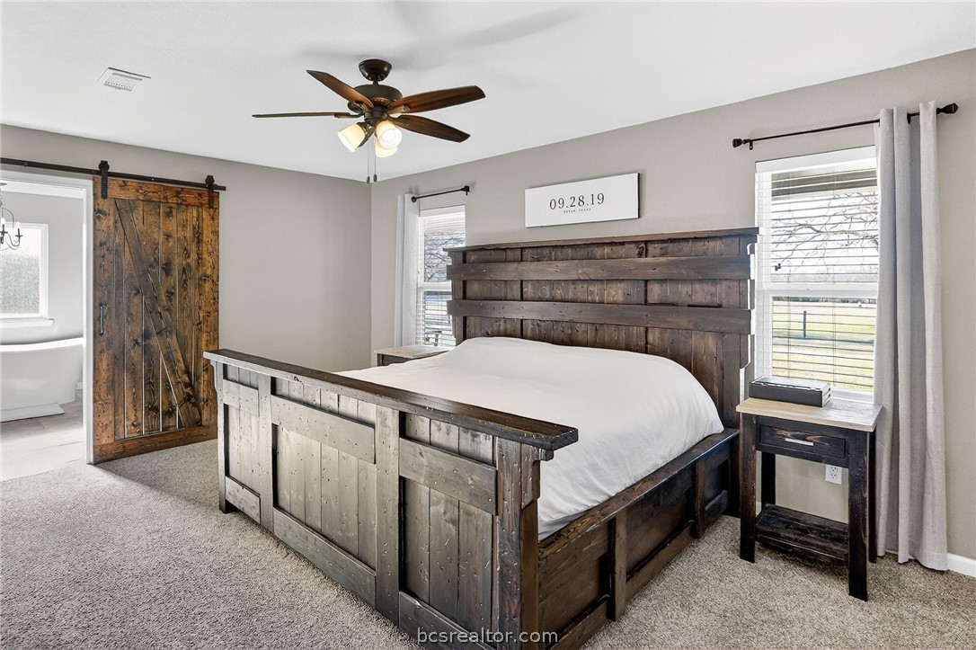 10054 Arnold Lane Bryan, TX 77845 - Photo 20 of 32 a bed room with a bed and a window