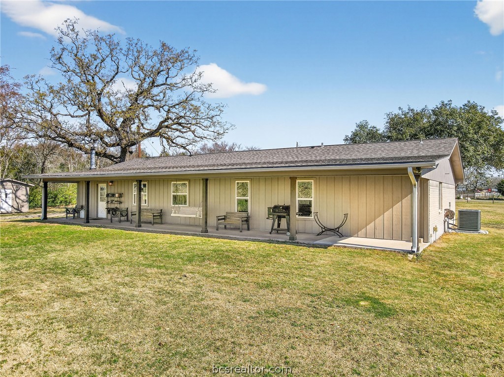 10054 Arnold Lane Bryan, TX 77845 - Photo 26 of 32 a view of a house with a yard and sitting area