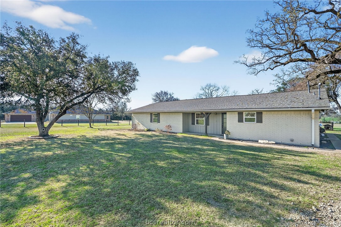 10054 Arnold Lane Bryan, TX 77845 - Photo 31 of 32 a view of a house with a backyard