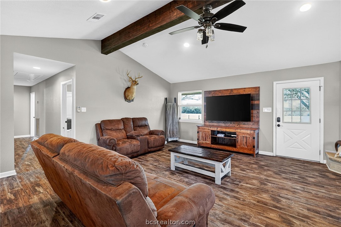 10054 Arnold Lane Bryan, TX 77845 - Photo 9 of 32 a living room with furniture and a flat screen tv