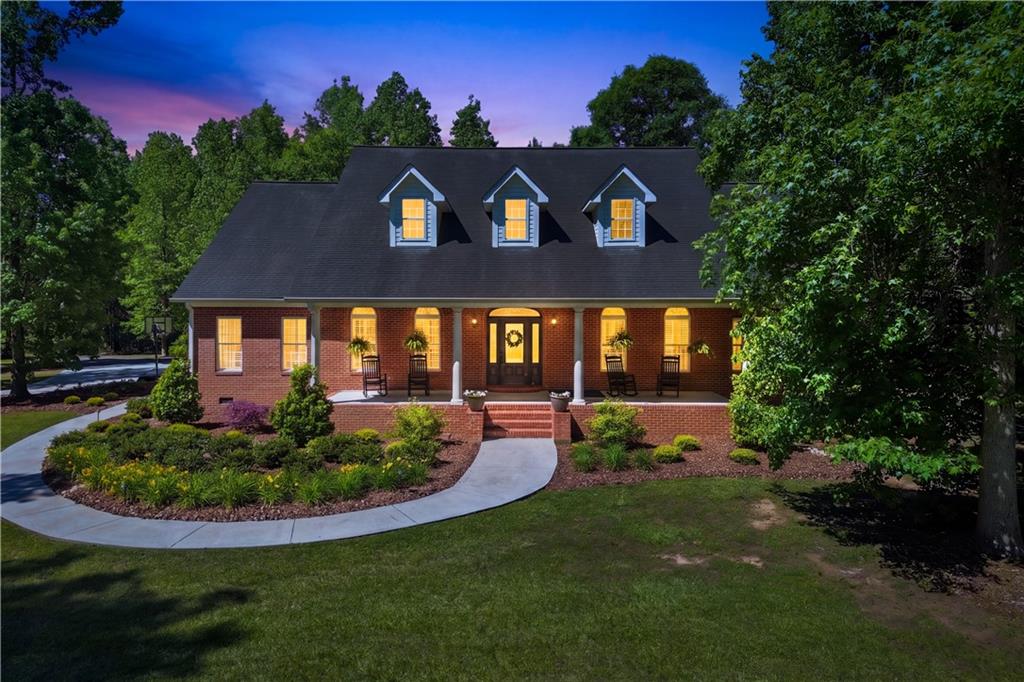 310 Gaines Road Southeast Dalton, GA 30721 - Photo 49 of 53 a view of a brick house with a big yard potted plants and large tree