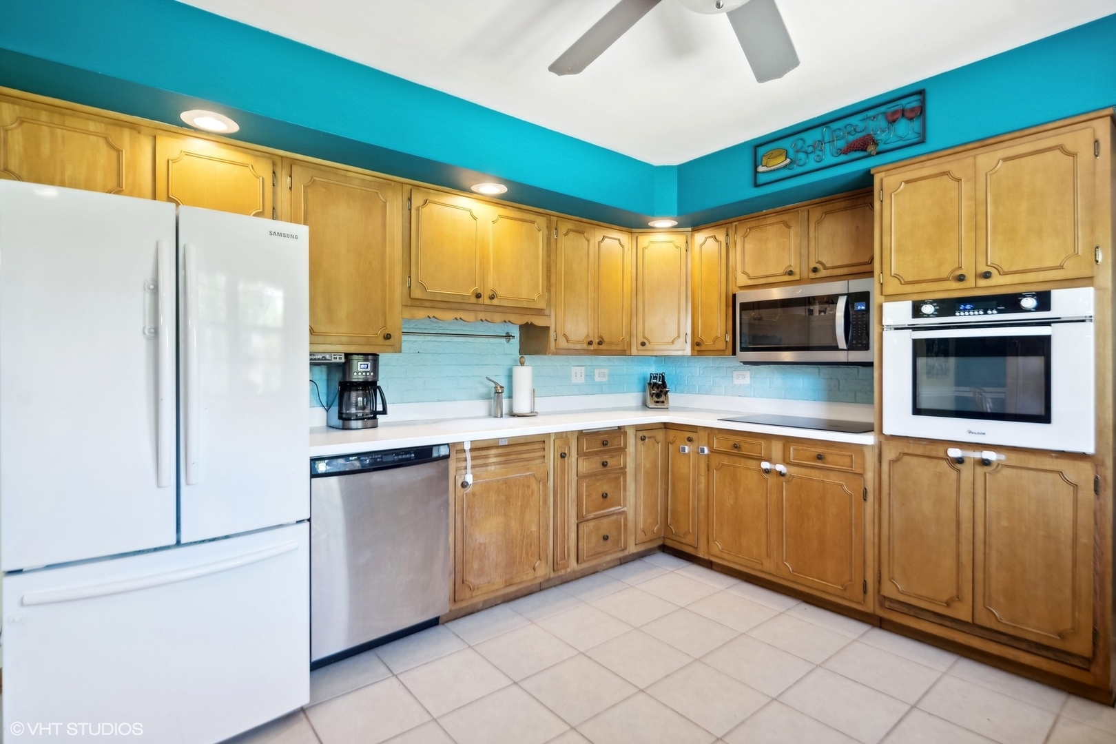 250 East Harrison Road Lombard, IL 60148 - Photo 12 of 32 a kitchen with granite countertop cabinets stainless steel appliances and a window