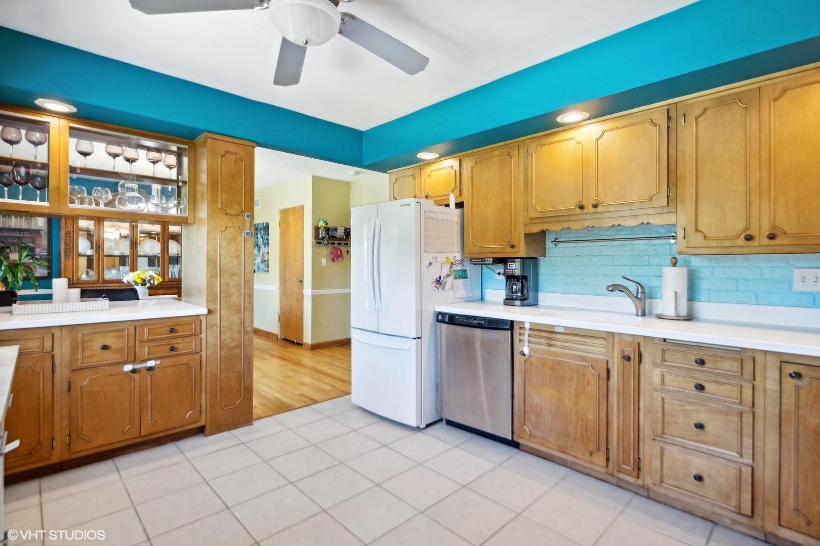 250 East Harrison Road Lombard, IL 60148 - Photo 14 of 32 a kitchen with white cabinets and white appliances
