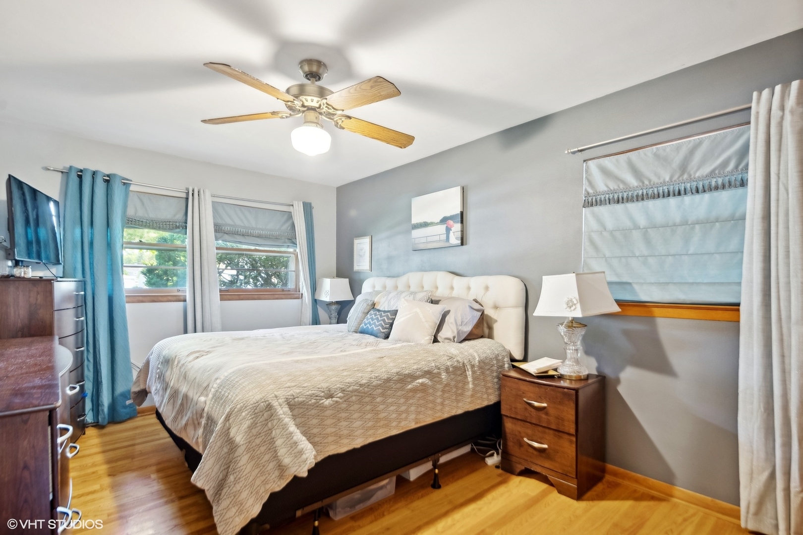250 East Harrison Road Lombard, IL 60148 - Photo 15 of 32 a bedroom with a bed and a chandelier